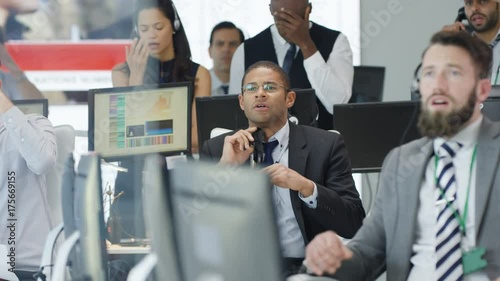  Financial traders watching the world markets react as the market crashes