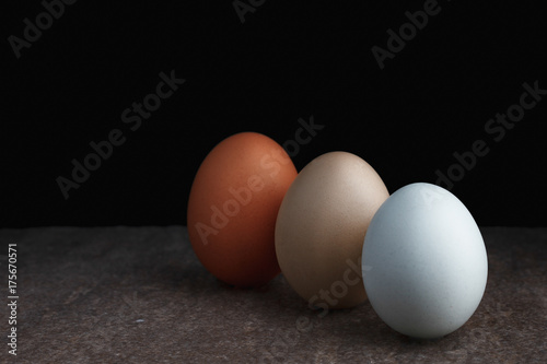 Three standing colorful eggs
