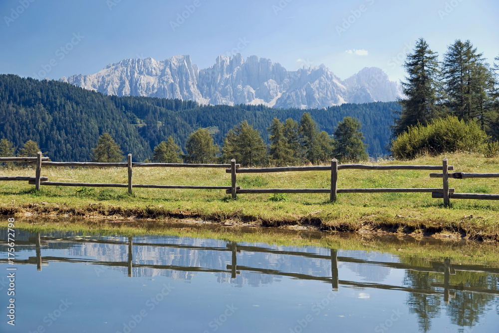 Reflection of the Latemar massif near Tiers, South Tyrol, Italy, Europe Reflection of the Latemar massif near Tiers, South Tyrol, Italy, Europe