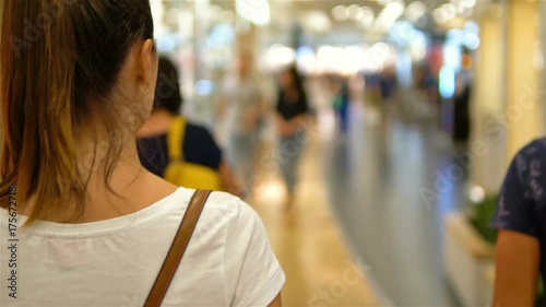 Young Woman Exploring Modern Shopping Mall In Slowmotion