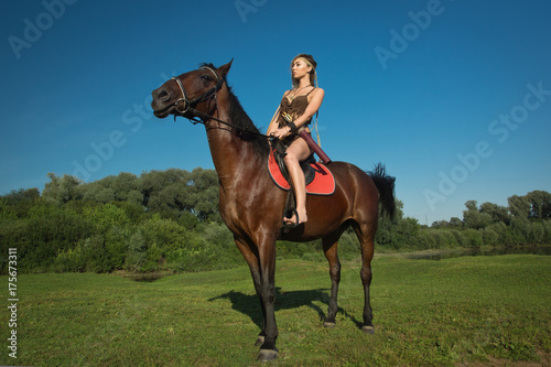 Wild amazon girl on horseback © Demian