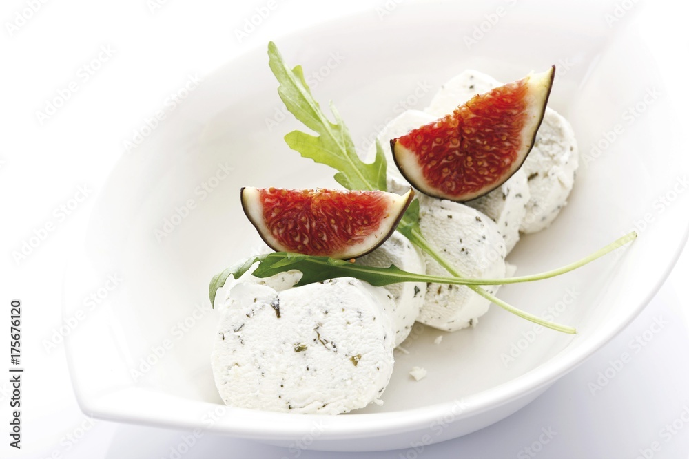 Fresh Figs (Ficus carica) with rucola and goat cheese Fresh Figs (Ficus carica) with rucola and goat cheese
