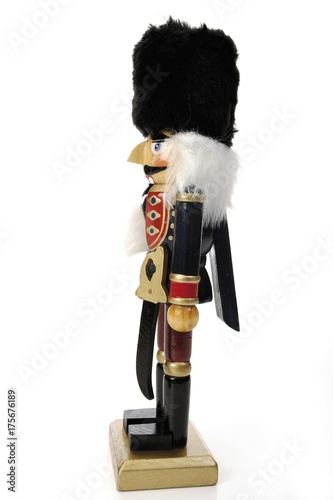 Nutcracker figurine with black felt hat, side-view