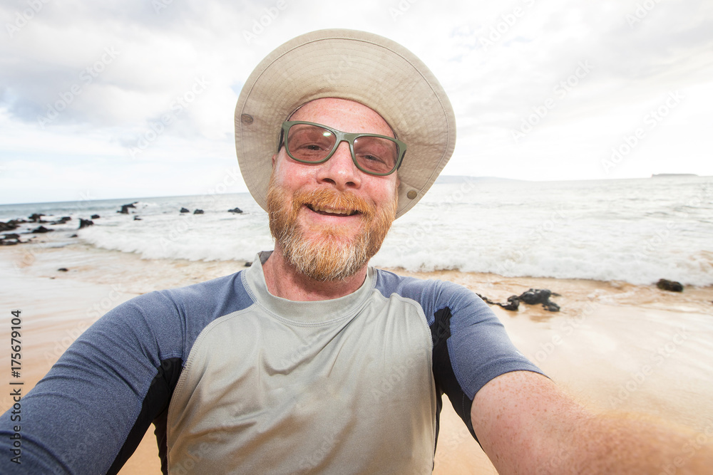 Happy man selfie at the beach