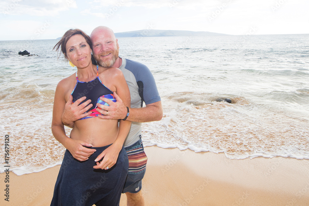 Man squeezing boobs at the beach Stock Photo