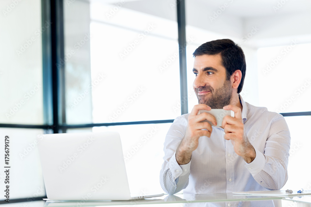 Confident young man in smart casual wear holding phone Confident young man in smart casual wear holding phone