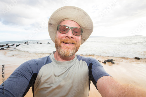 Happy man selfie at the beach