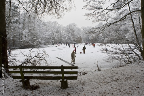 Children skating on frozen lake, Hesse, Germany, Europe photo