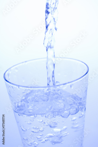 Pouring mineral water into a glass