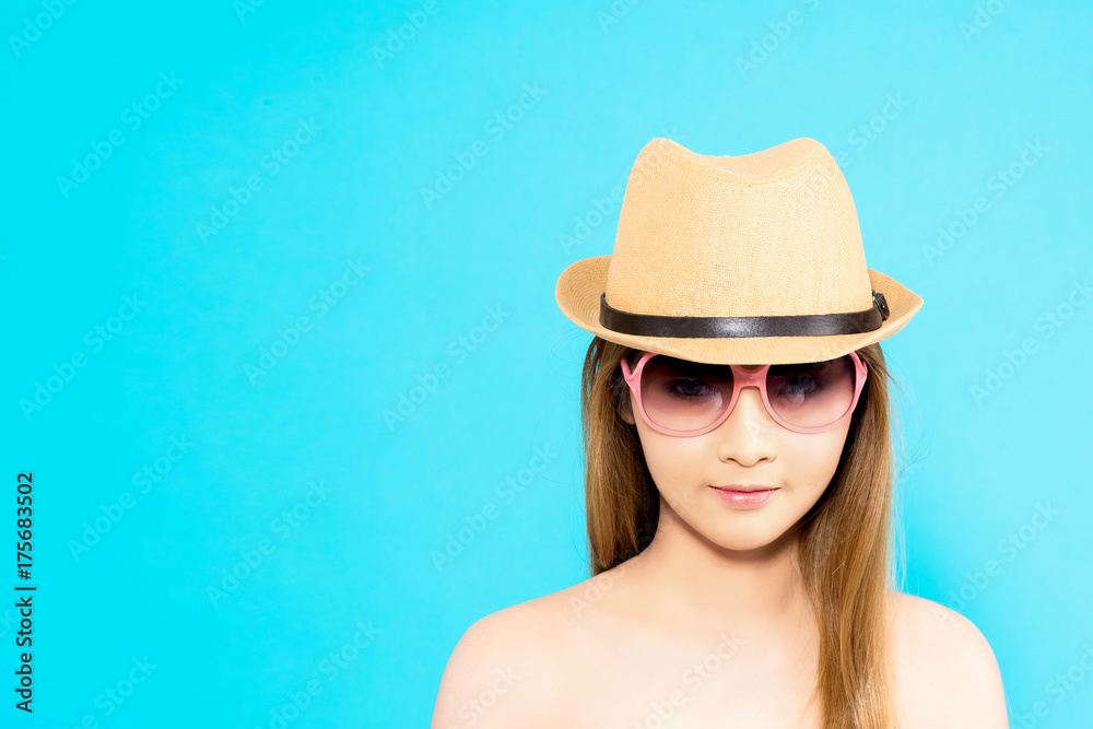 Young Asian woman with happy smile isolated on blue background. Young Asian woman with happy smile isolated on blue background.