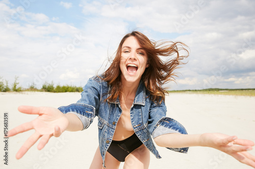 A model topless with jeans jacket in happy 