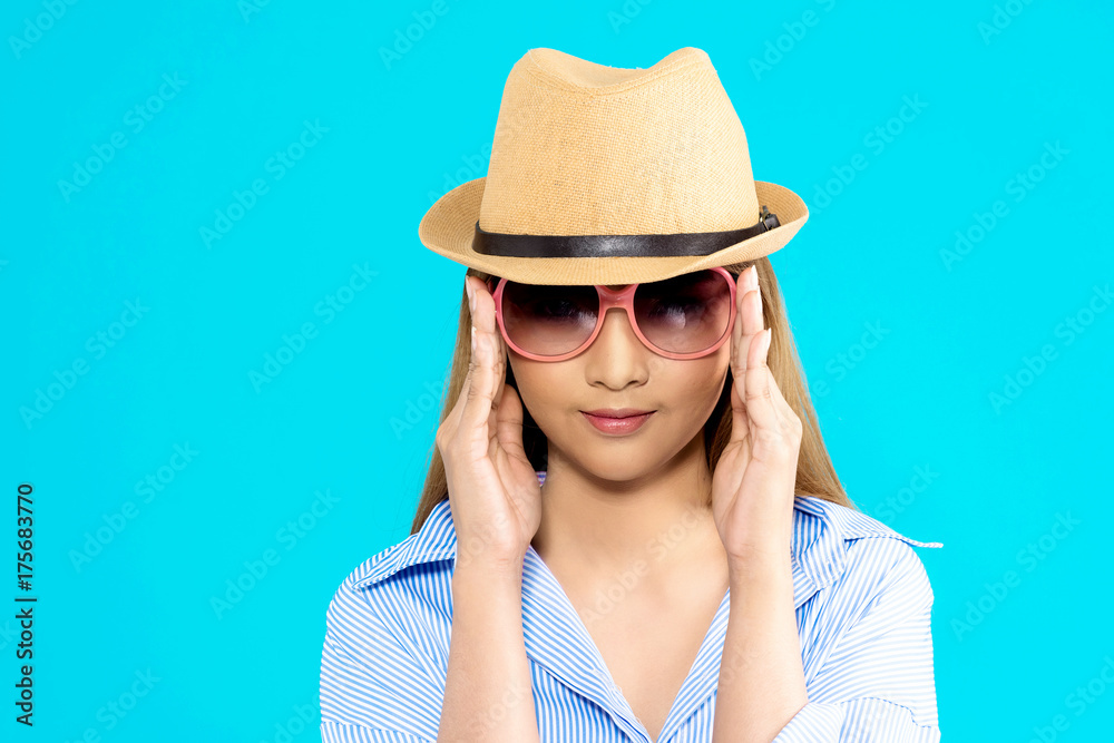 Young Asian woman thinking isolated on blue background. Young Asian woman thinking isolated on blue background.