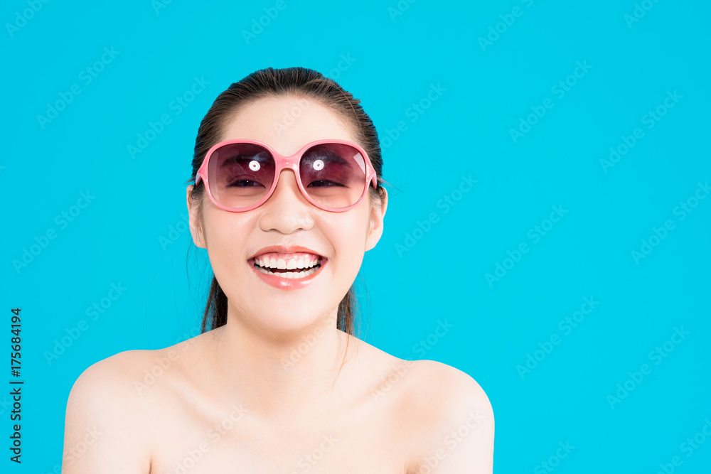 Young Asian woman with happy smile isolated on blue background. Young Asian woman with happy smile isolated on blue background.