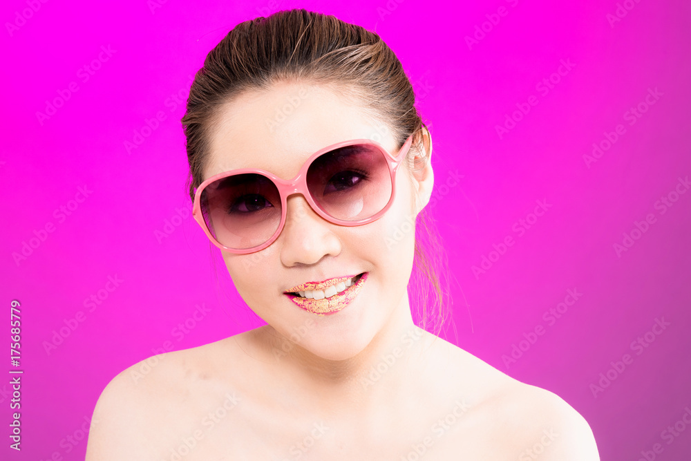 Young Asian woman with happy smile isolated on pink background. Young Asian woman with happy smile isolated on pink background.