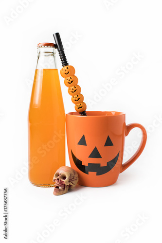 halloween coffee cup mug drink with skull and juice bottle and tube on white isolated