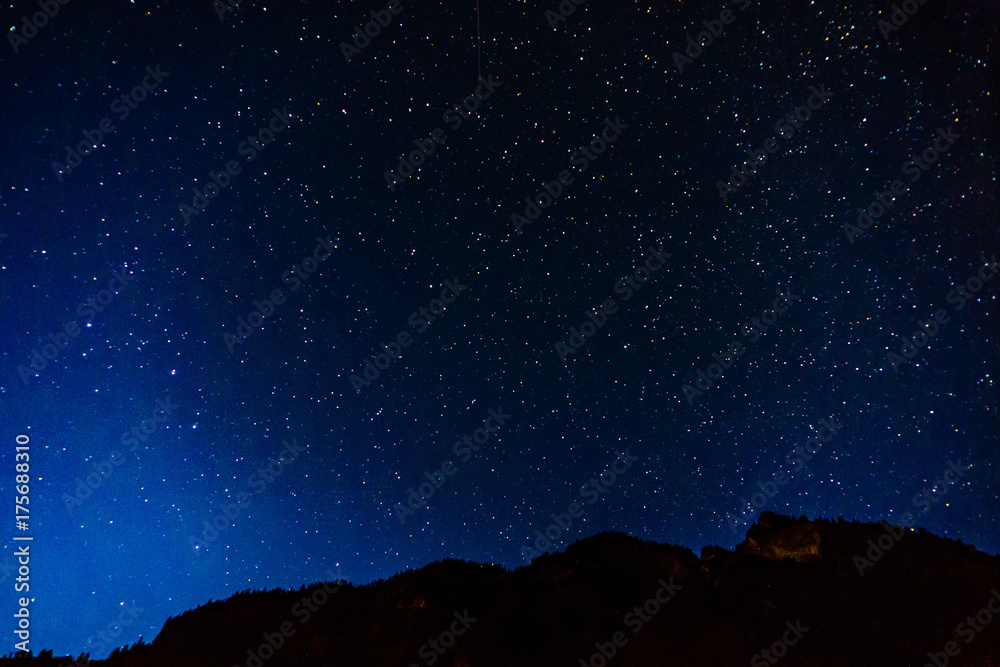 Many starts on blue dark night sky as a cosmos background.
