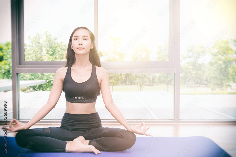 Beautiful young fit asian woman doing yoga. Beautiful young fit asian woman doing yoga.