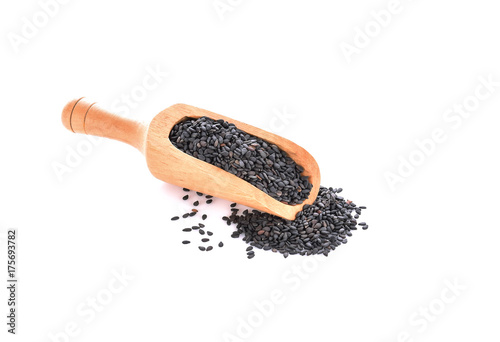 Black sesame in scoop on a white background