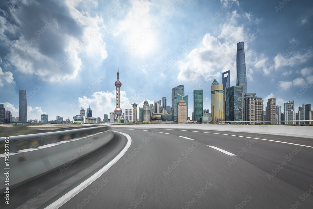 urban traffic road with cityscape in background in Shanghai, China..