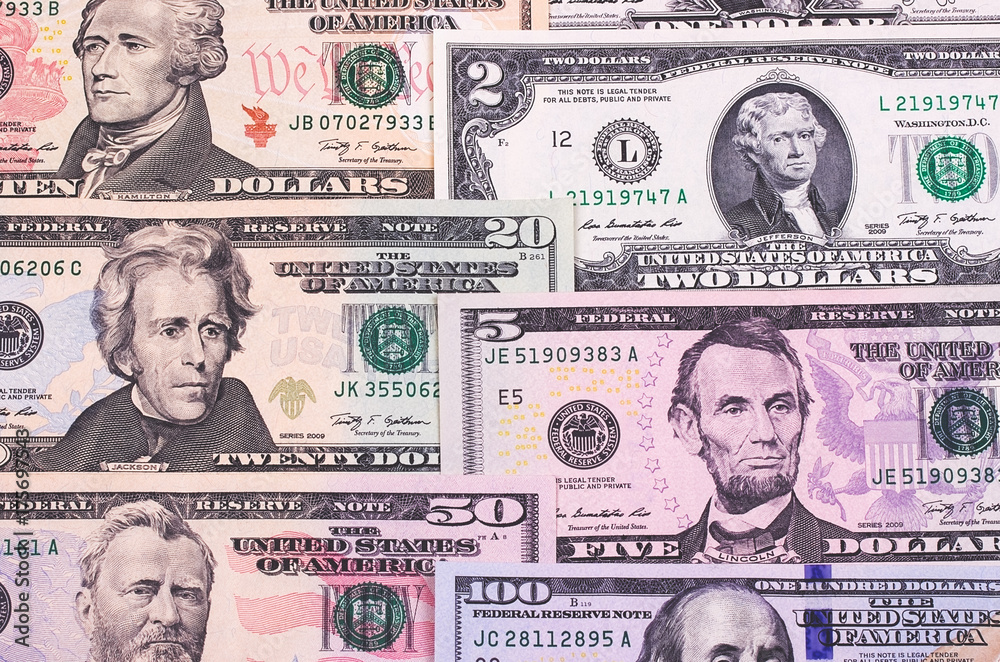 Abstract american dollar bills of different denomination background.