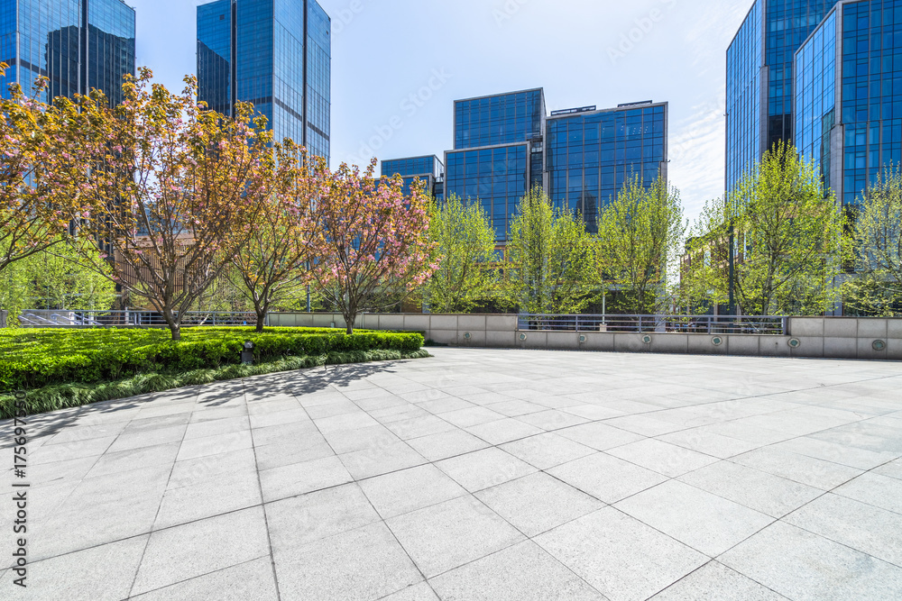 Fototapeta premium empty pavement and modern buildings in the city of shanghai