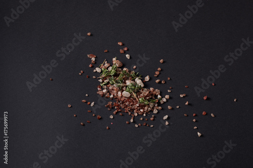 Spices scattered on a black background