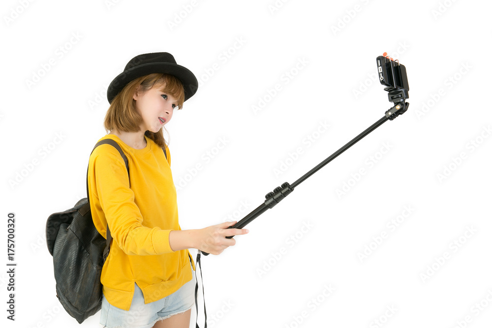Portrait of asian woman takes a selfies with monopod isolated on white background. Portrait of asian woman takes a selfies with monopod isolated on white background.