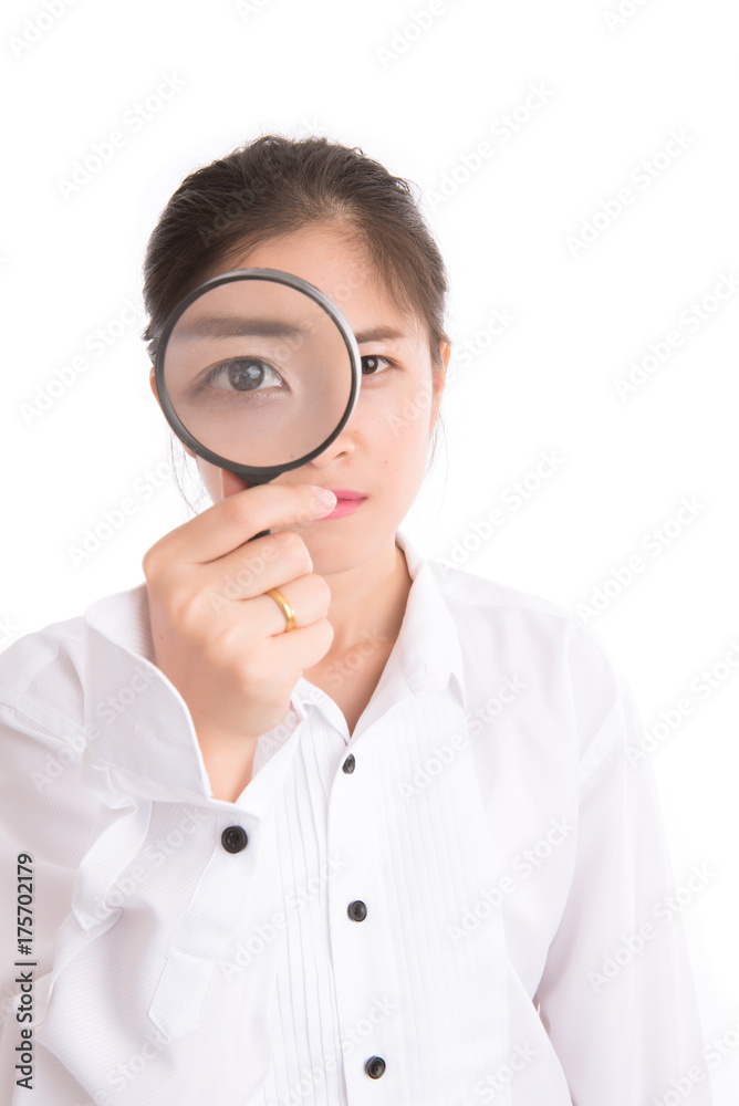 Portrait of woman looking through a magnifying glass. Concept detective. Portrait of woman looking through a magnifying glass. Concept detective.