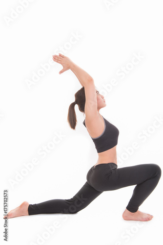Young beautiful asian woman yoga posing on a white background .