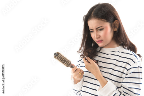 Portrait  of asian woman long hair with a comb and problem hair on white background. This image for hair loss concept.