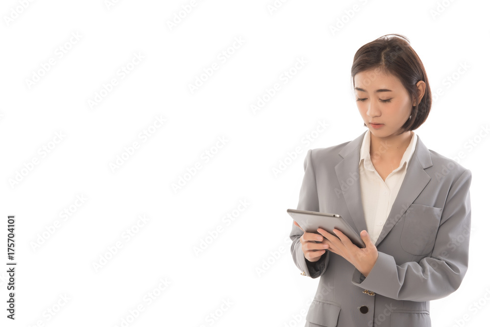 Portrait of asian businesswoman touching digital tablet and looking at it. This picture for working woman concept. Portrait of asian businesswoman touching digital tablet and looking at it. This picture for working woman concept.