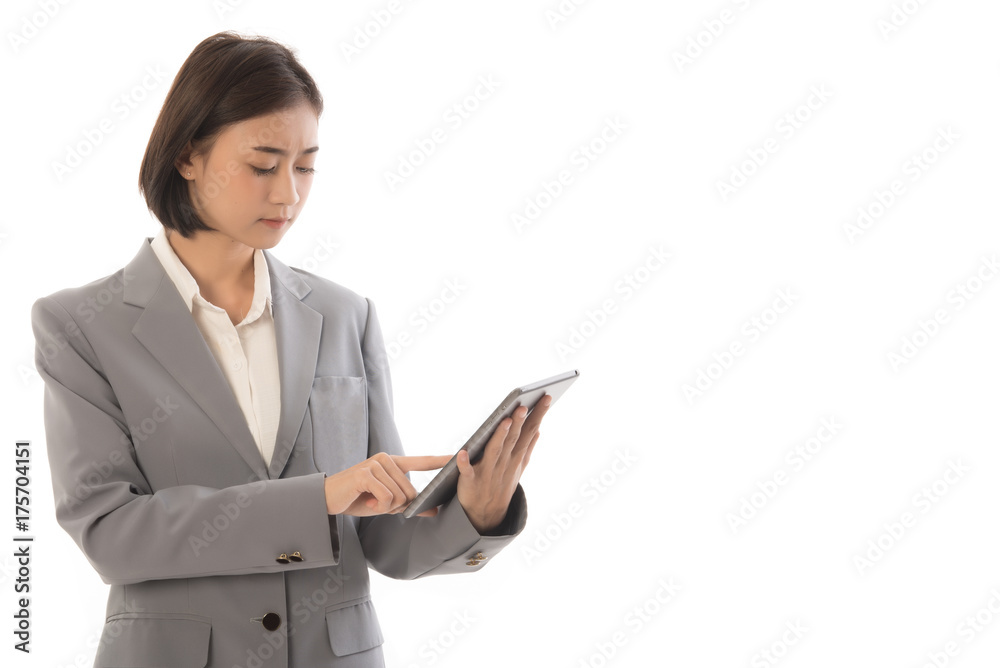 Portrait of asian businesswoman touching digital tablet and looking at it and serious, Free form copy space, This picture for working woman serious with her job concept. Portrait of asian businesswoman touching digital tablet and looking at it and serious, Free form copy space, This picture for working woman serious with her job concept.