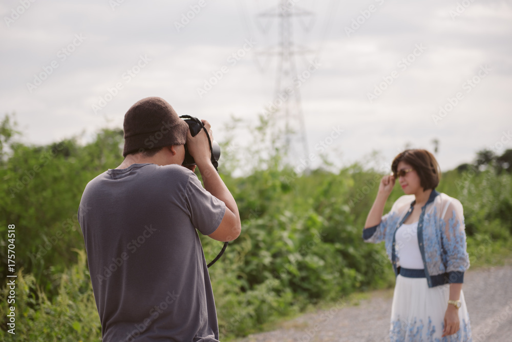 Photographer working with model . Asian photography in action. Concept behind the scenes. Photographer working with model . Asian photography in action. Concept behind the scenes.