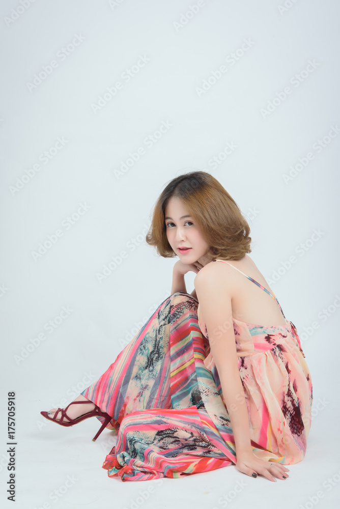 studio fashion portrait of beautiful young asian woman, sitting, on white background, posing at camera. Thai woman model in studio. studio fashion portrait of beautiful young asian woman, sitting, on white background, posing at camera. Thai woman model in studio.