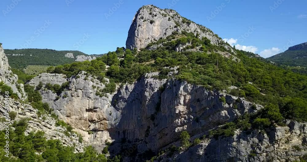 big rock cliff with aerial shoot going up to the sky big rock cliff with aerial shoot going up to the sky