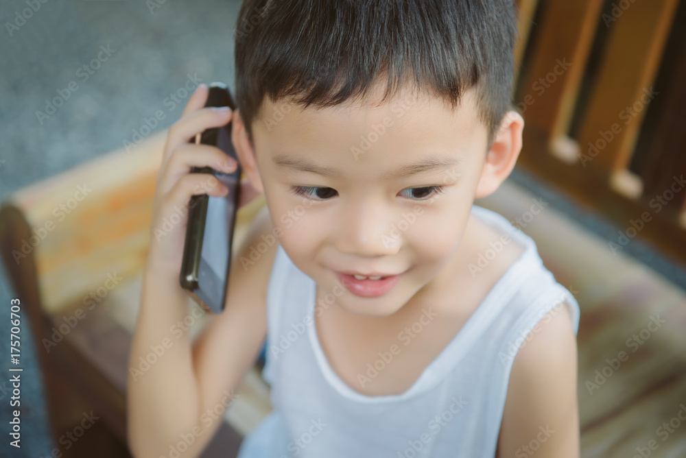Portrait of asian boy use smartphone talk with mom, FaceTime, Miss mom concept. Portrait of asian boy use smartphone talk with mom, FaceTime, Miss mom concept.