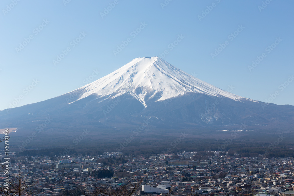 Naklejka premium Fuji mountain and Fujiyoshida city with blue sky in the morning