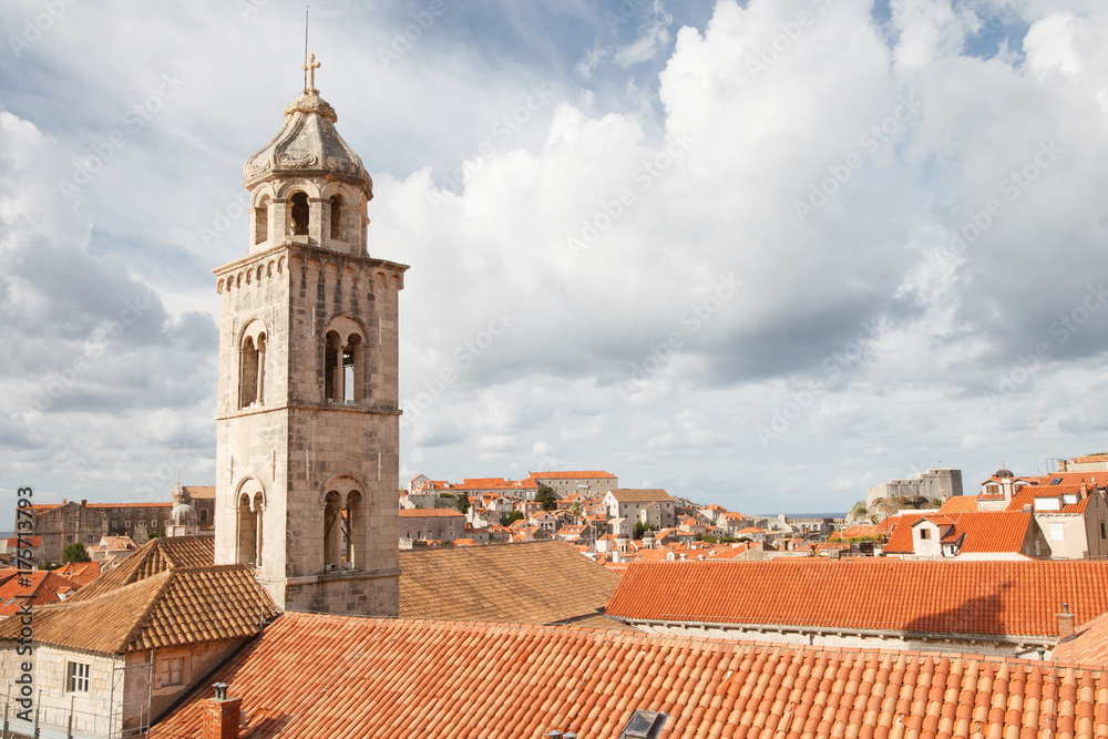Dominican Monastery's bell tower and red roofs at the Old Town in Dubrovnik, Croatia.