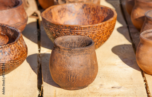 vintage pottery on wooden surface. © bborriss