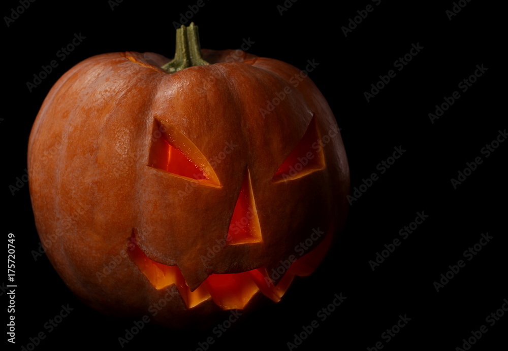 Halloween pumpkin with scary face. Jack O' Lantern isolated on black Halloween pumpkin with scary face. Jack O' Lantern isolated on black