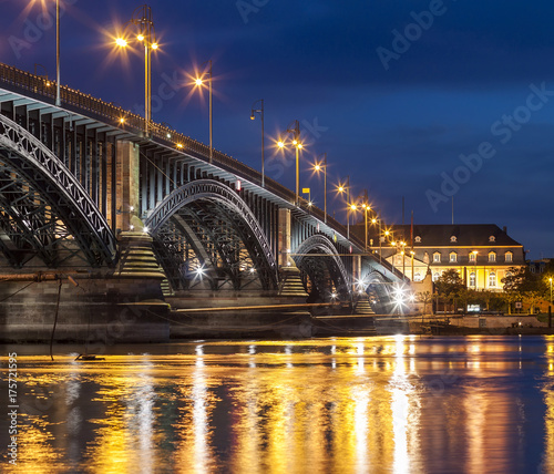 Beautiful sunset night over Rhine / Rhein river and old bridge in Mainz near Frankfurt am Main, Germany. © bilanol