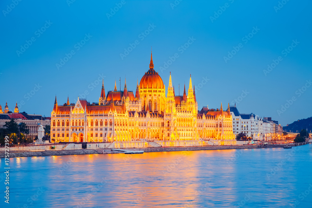 Evening view of Hungarian Parliament with Margit bridge. Famous place Budapest, Hungary, Europe.