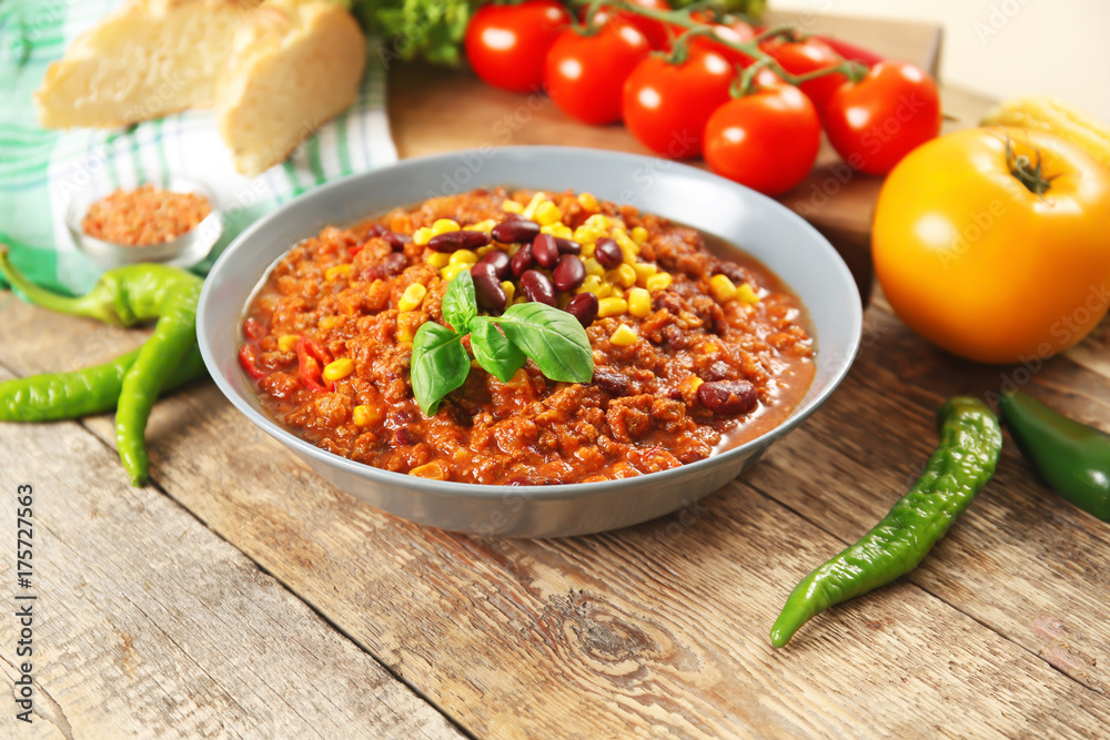 Bowl with delicious chili con carne on table Bowl with delicious chili con carne on table