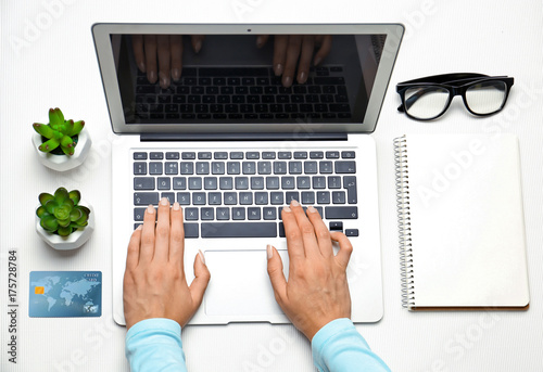 Woman using laptop for onli...