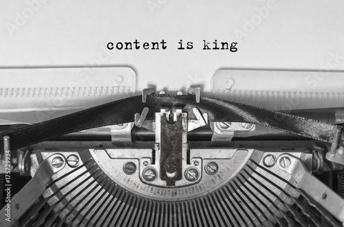 content is king typed words on a vintage typewriter. Close-up.