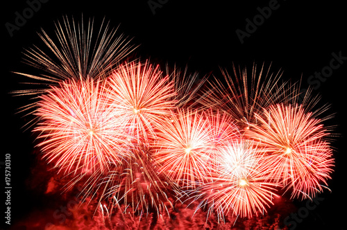 Flashes of fireworks of red  gold and white color