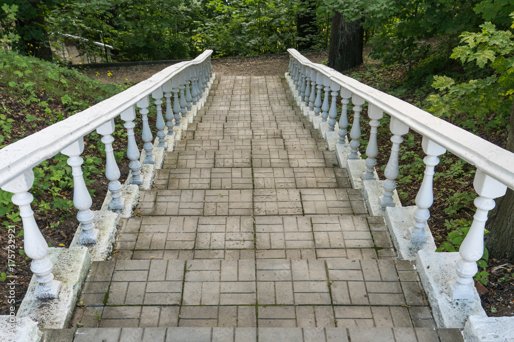 A staircase with a balustrade in the park.