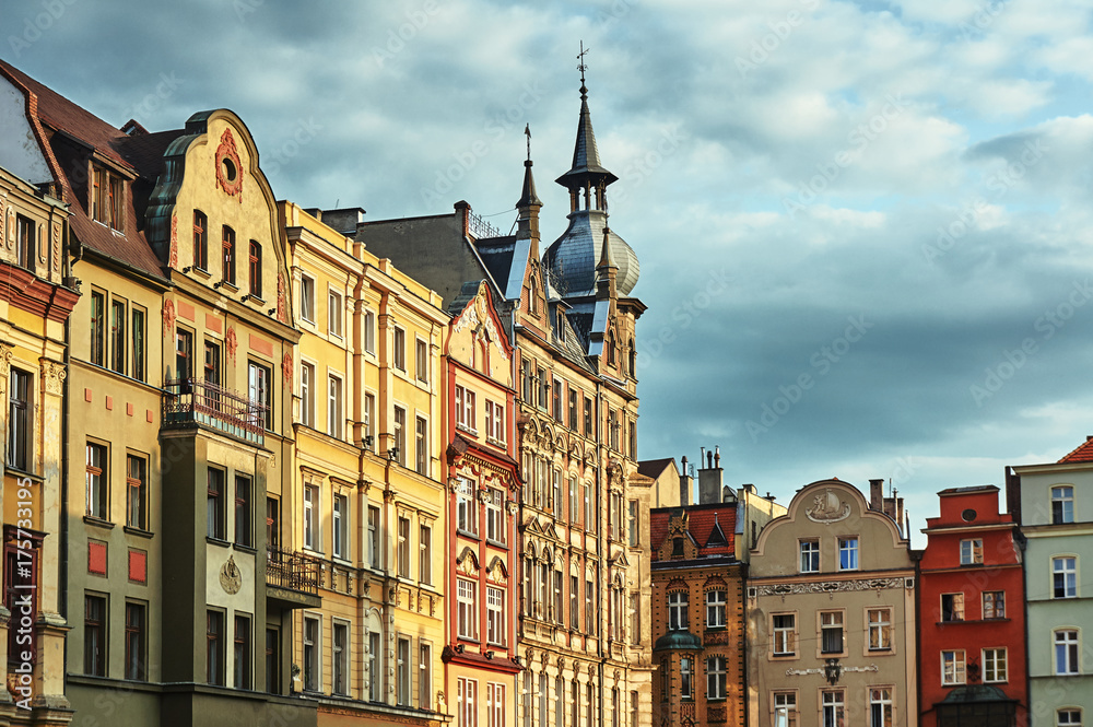 Facades of historic tenement houses on the market in Swidnica in Poland.