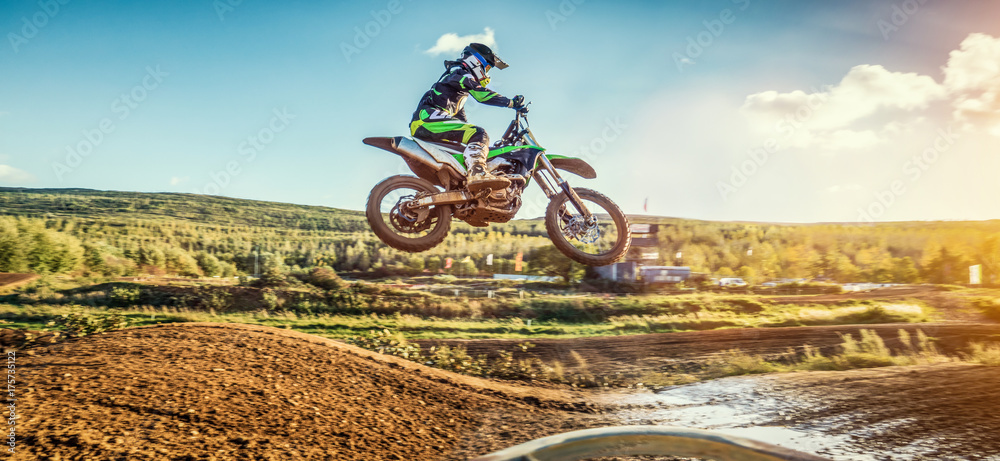 Extreme Motocross MX Rider riding on dirt track - obrazy, fototapety, plakaty 