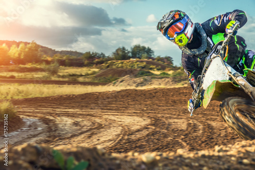 Fototapeta Naklejka Na Ścianę i Meble -  Extreme Motocross MX Rider riding on dirt track